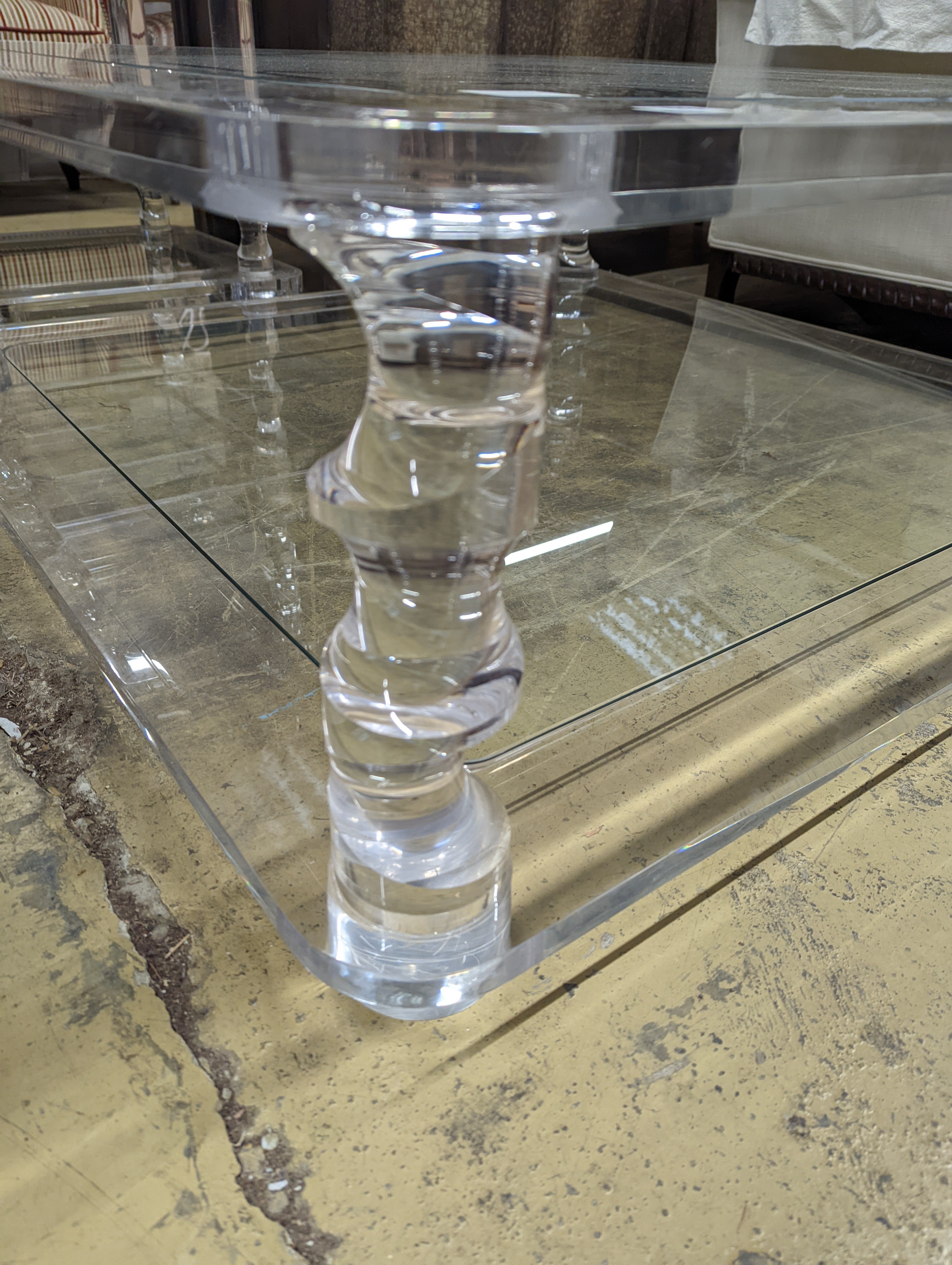 A contemporary square perspex and glass two tier coffee table, length 120cm, depth 40cm